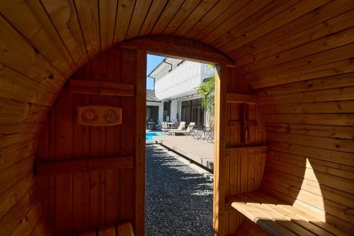 an inside view of a wooden sauna with an open door at Nanki Shirahama Villa IRIS in Kanayama