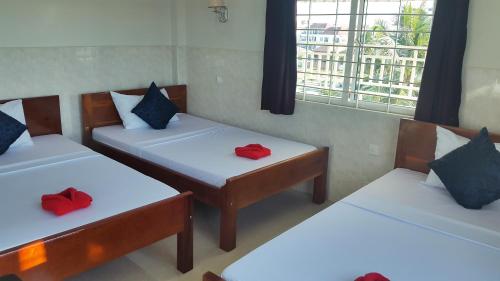 Postel nebo postele na pokoji v ubytování Siem Reap Pub Hostel