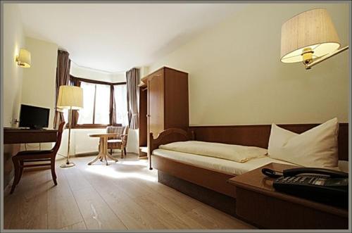 Кровать или кровати в номере Hotel Baeren