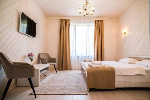 Postel nebo postele na pokoji v ubytování Oasis Karpat