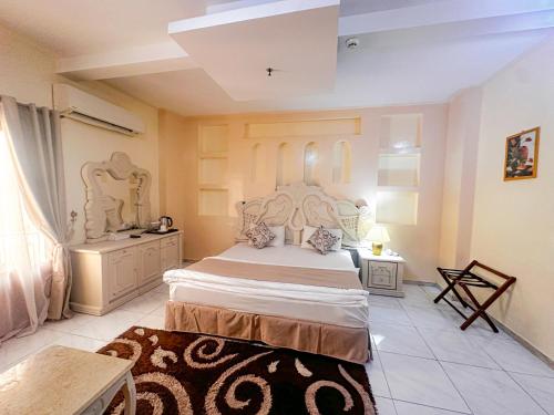 Postel nebo postele na pokoji v ubytování Riyam Hotel
