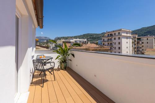 a balcony with a table and a chair on a building at Boutique Suites 186 in Sorrento
