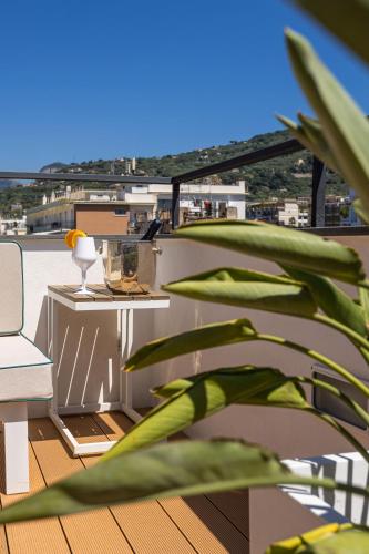 a view of a balcony with a table and a plant at Boutique Suites 186 in Sorrento