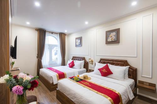 En eller flere senge i et værelse på Kim Chi An Hotel DL - by BAY LUXURY