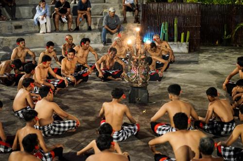 a group of men sitting around a stage with aorah at Shore Amora Canggu in Canggu