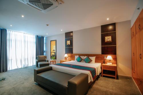 Postel nebo postele na pokoji v ubytování Petro Hotel