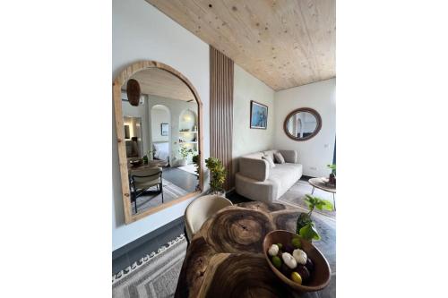 a living room with a couch and a mirror at Nafsi Nomad in Paje