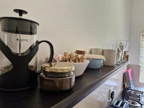 a counter with a blender and a bowl of food at B&B on Buckingham Guest House in Johannesburg