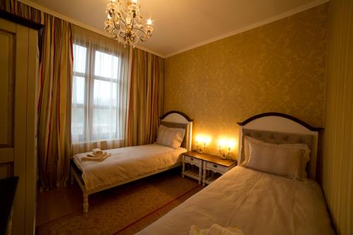 Ένα ή περισσότερα κρεβάτια σε δωμάτιο στο Midalidare Hotel & Spa