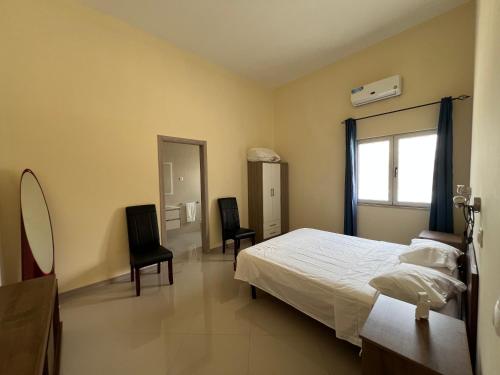 Postel nebo postele na pokoji v ubytování Praia Capital Residence Aparthotel