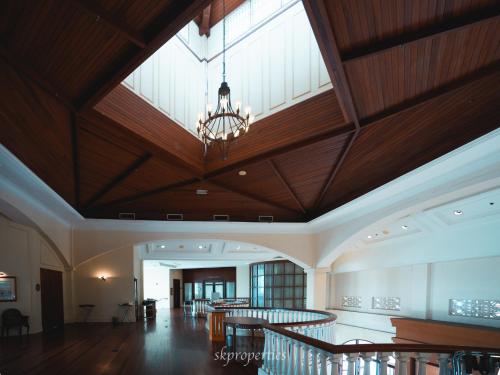 a large room with a large ceiling with a chandelier at Seaview Suites at Admiral Bay in Port Dickson