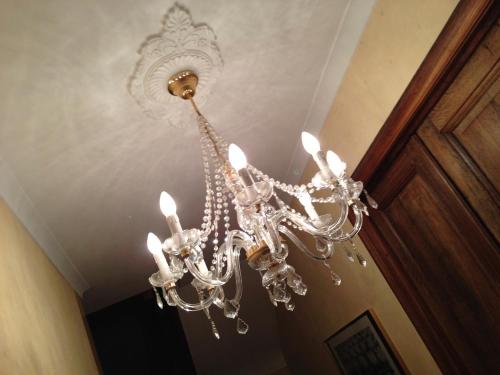 a chandelier is hanging from a ceiling at De Brugdraaier - The Bridge Turner in Neerpelt