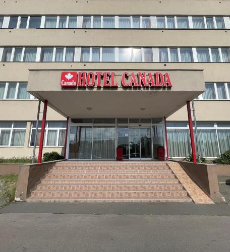 a hotel canada sign in front of a building at Canada Hotel Budapest in Budapest