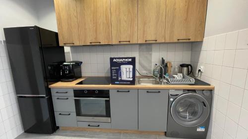 Dapur atau dapur kecil di APARTAMENT Św Jerzego