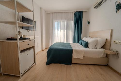 Katil atau katil-katil dalam bilik di Mia Hill Suites