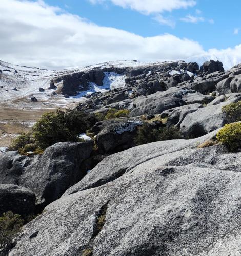 a group of rocks with snow on a mountain at Royale on Cheese in Castle Hill