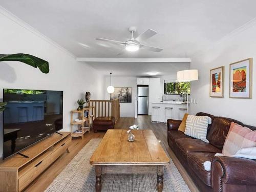 a living room with a couch and a coffee table at Young unit3 Lake Access in Nagambie