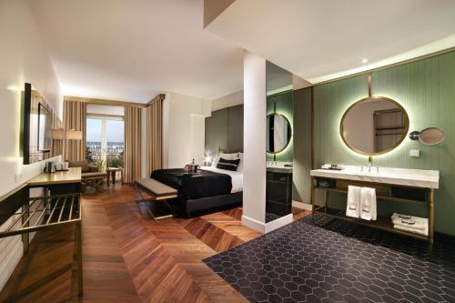 a hotel room with a bed and a mirror at 39 Kalamış Marina Hotel & Restaurant in Istanbul