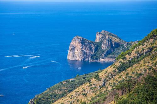 a view of the ocean and a mountain at VillaCrapolla Sorrento in Massa Lubrense
