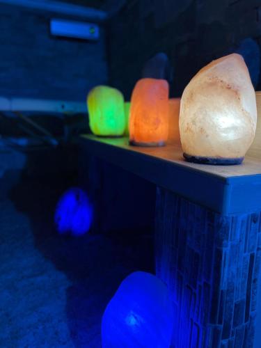 a group of different colored bowls on a table at Re Sole Resort&Spa in Grottaglie