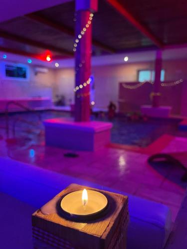 a candle sitting on a table in a room at Re Sole Resort&Spa in Grottaglie