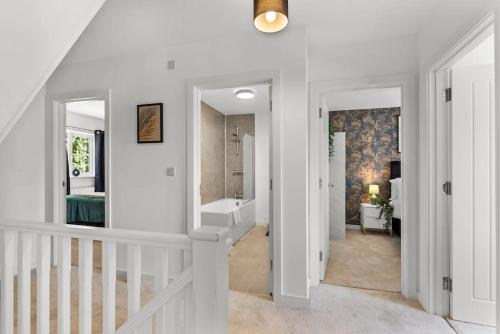 a hallway with a staircase leading to a bathroom at Large and Stylish Abode in Nottingham - Sleeps 15 in Nottingham