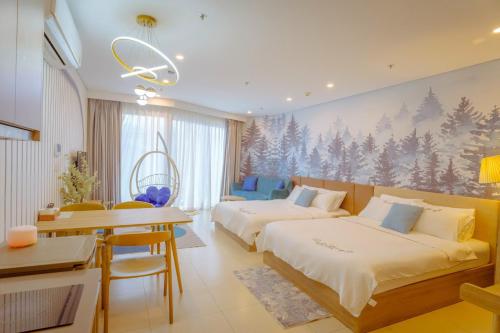 Postel nebo postele na pokoji v ubytování Dứa's House - The Sóng Vũng Tàu, Sky Pool & Gym