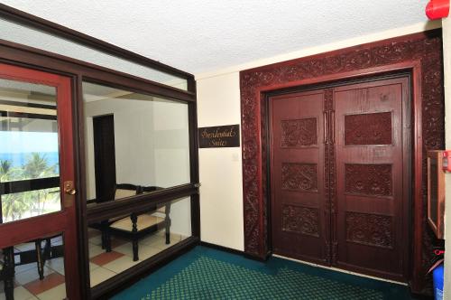 an entrance to a room with a door and a window at Mombasa Continental Resort in Shanzu