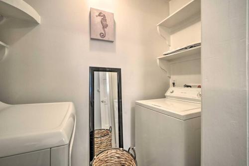 a white laundry room with a washer and dryer at Dreamcatchers in North Beach