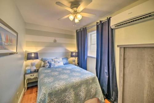 a bedroom with a bed and a ceiling fan at Dreamcatchers in North Beach