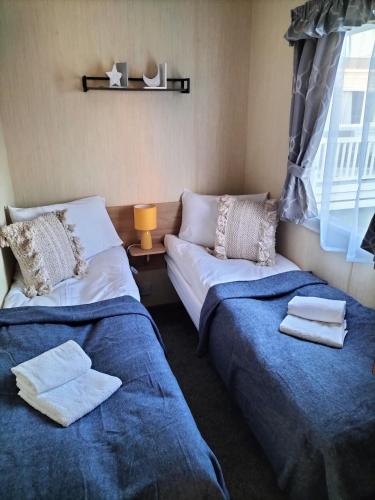 Katil atau katil-katil dalam bilik di 3 Bedroom Caravan, Edi Rita, Robin Hood, Pet Friendly