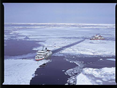 two boats in the water with snow and ice at Moritsubetsu in Tsubetsu