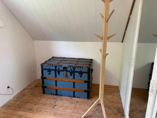 a room with two suitcases in a attic at Ferienwohnung auf dem Bauernhof in Mariannelund