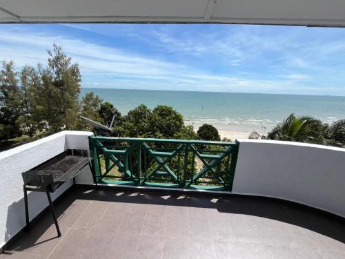 a balcony with a view of the beach at Bayu Beach Resort PortDickson Santai PD Homestay Penthouse Seaview in Port Dickson