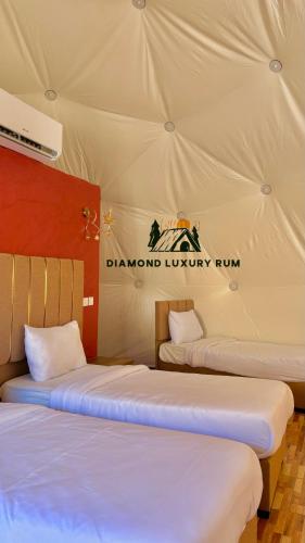 Voodi või voodid majutusasutuse Diamond luxury rum toas