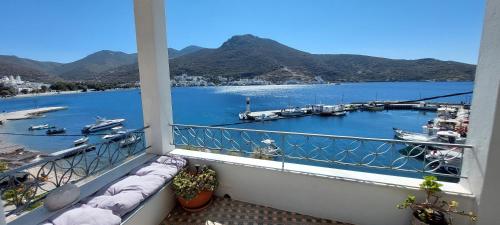 a balcony with a view of a marina at Kalliopis Rooms in Katapola