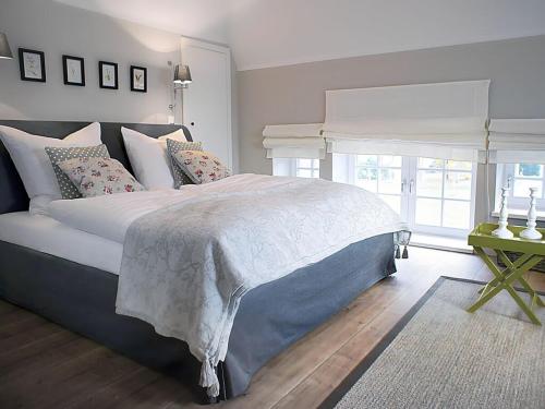 a bedroom with a large bed and a window at Attractive apartment in Westerstede in Westerstede