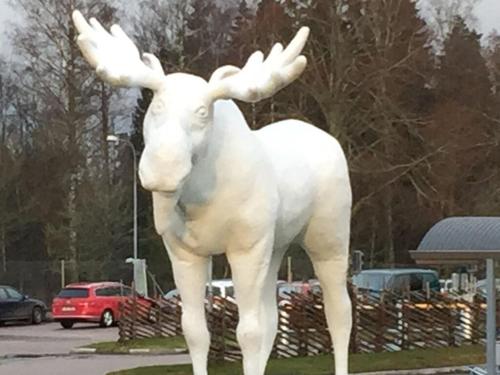 a statue of a moose standing in a parking lot at Modern apartment in Vimmerby in Vimmerby