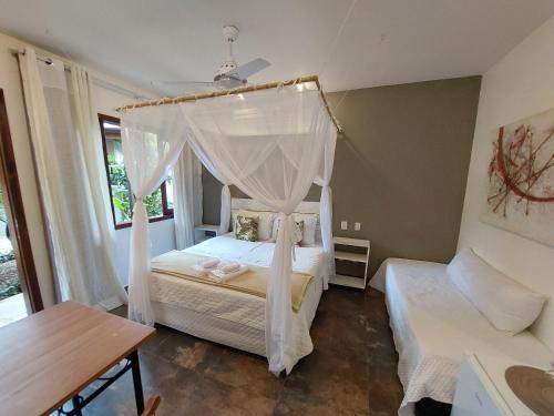Ένα ή περισσότερα κρεβάτια σε δωμάτιο στο Magias de Paraty Ecopousada