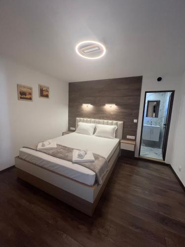 a bedroom with a large bed in a room at ВИЛА ЯНА Villa Yana in Presoka