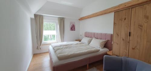 Ένα ή περισσότερα κρεβάτια σε δωμάτιο στο Haus Hinz 3-Zi Fe-Wo an der Ostsee