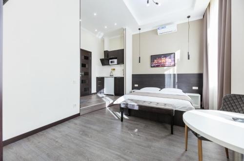 Postel nebo postele na pokoji v ubytování Apart-hotel -911 Mikhailovsky