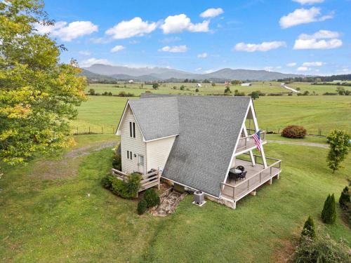an overhead view of a tiny house in a field at Old Rag A-Frame: Mountain Views Hot Tub Fire Pit in Etlan