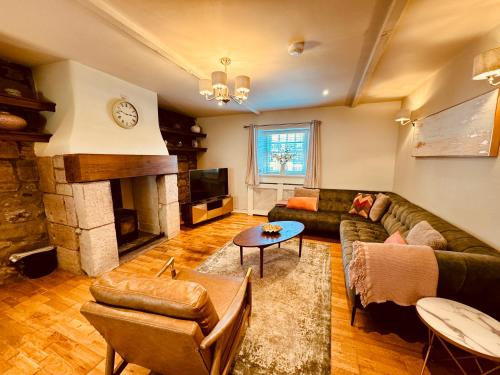 Un lugar para sentarse en HomeDecor Cottages - Old Stable House