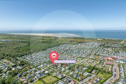 an aerial view of a large city with a red sign at Welcome in - Vakantiewoning met ruime tuin en open haard I Horizon 3 Renesse in Renesse