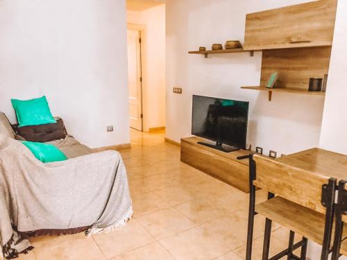Televízia a/alebo spoločenská miestnosť v ubytovaní Bamboo Apartment