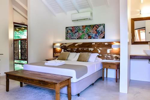 En eller flere senge i et værelse på Pousada Forte Rocha