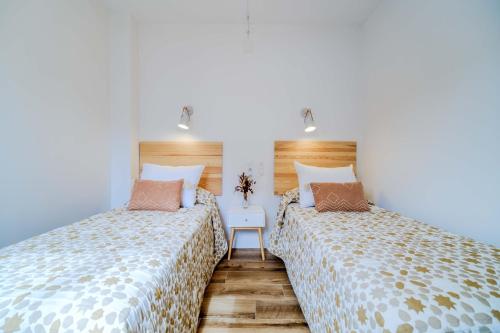 Ένα ή περισσότερα κρεβάτια σε δωμάτιο στο Esencia del Arenal Javea Apartment by Rock Rentals