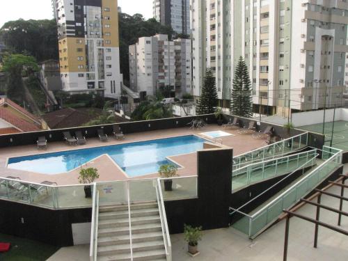 a swimming pool on the roof of a building at RCM Vilas - Morada 409 in Joinville