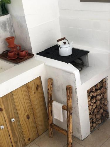 a kitchen with a stove with a pot on it at CasaIvan in Florianópolis